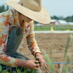 Working on irrigation lines at Headwaters Farm