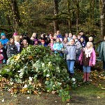 children remove invasive plants from Oxbow