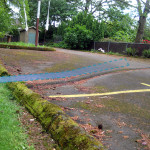 speed bump redirecting stormwater, with arrow