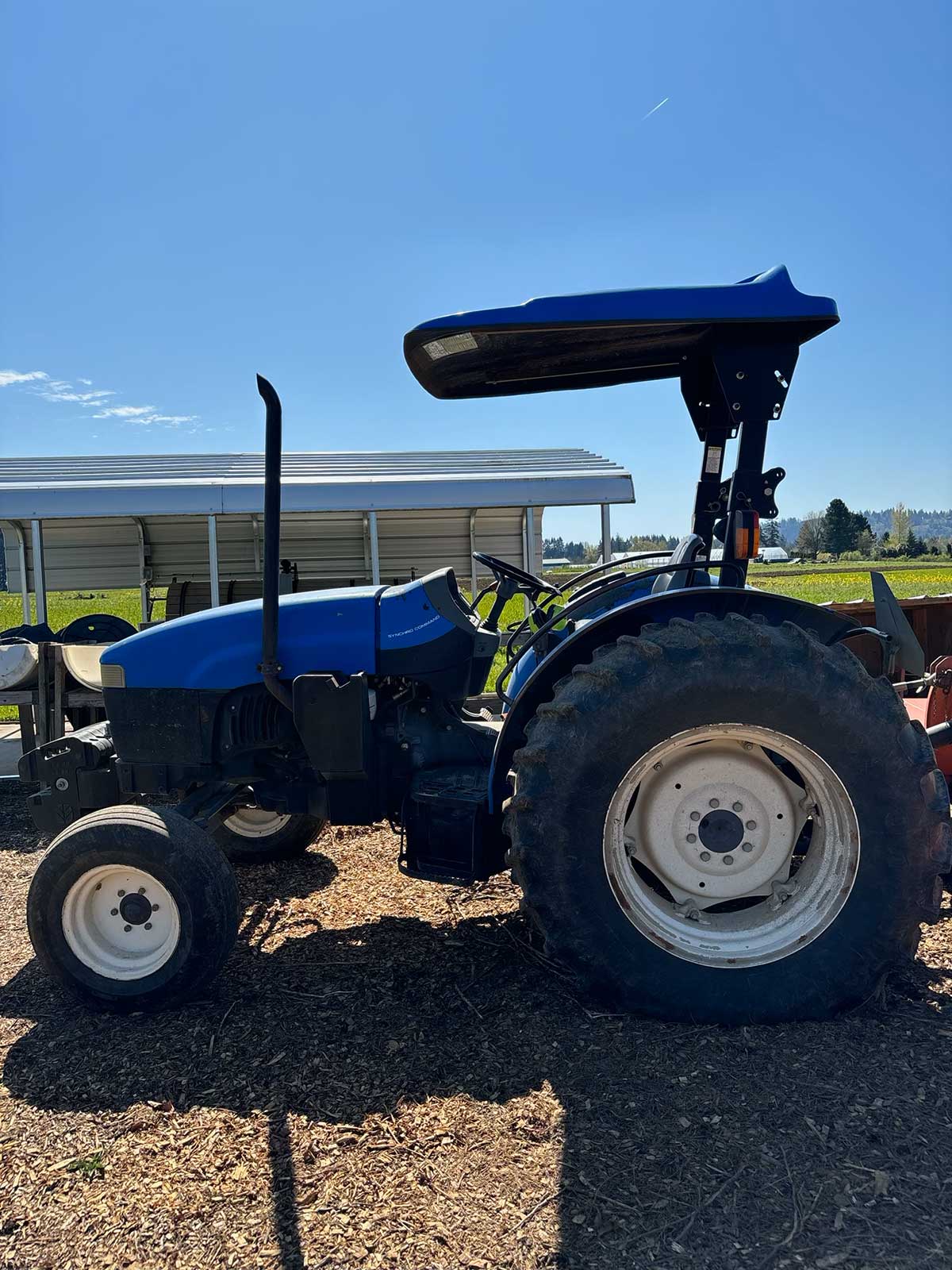 photo of a TN75 tractor on a farm