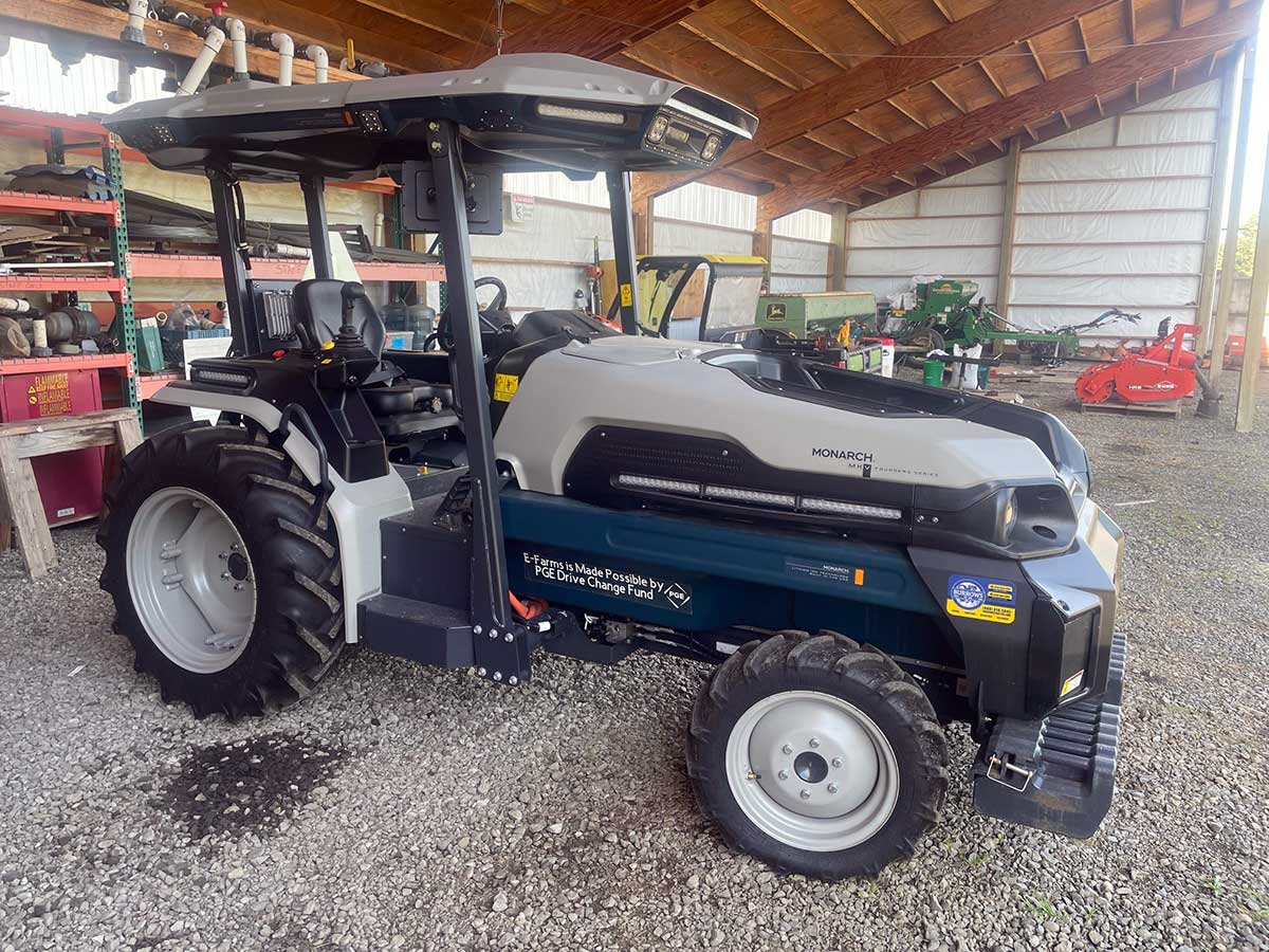 photo of a Monarch tractor sitting in an open bay equipment shed